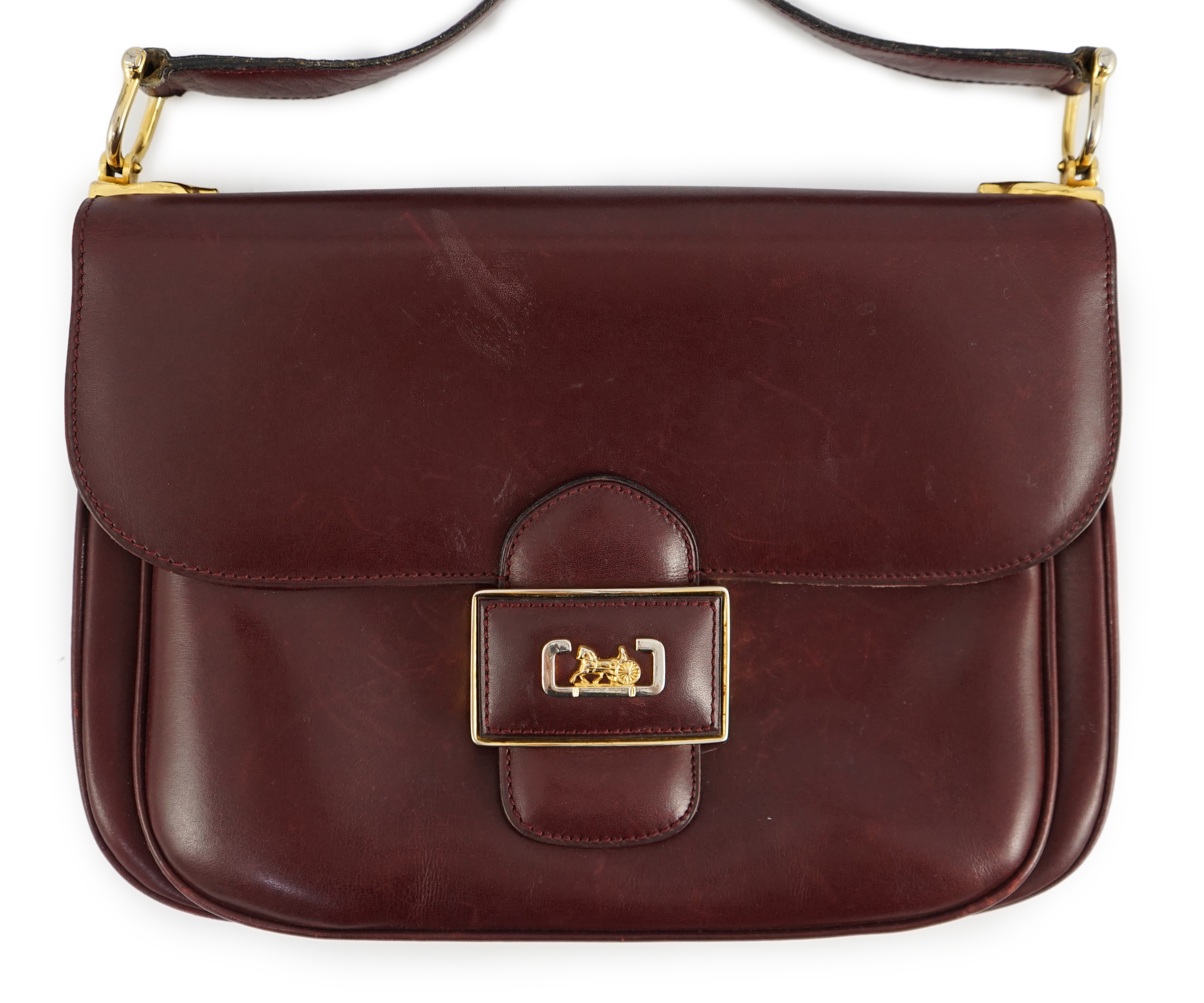 A vintage Celine horse carriage cargo flap burgundy leather shoulder bag, width 26cm, depth 3cm, height 18.5cm
